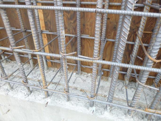 Steel reinforcement bars (rebar) arranged and tied together to form a 
