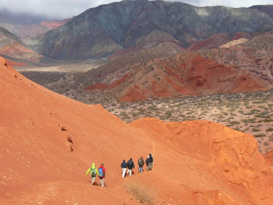 Group hiking in a mountainous adventure landscape