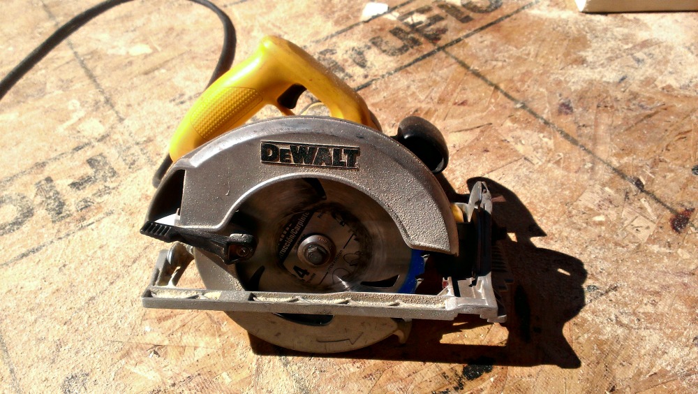 DeWalt brand circular saw on wooden surface