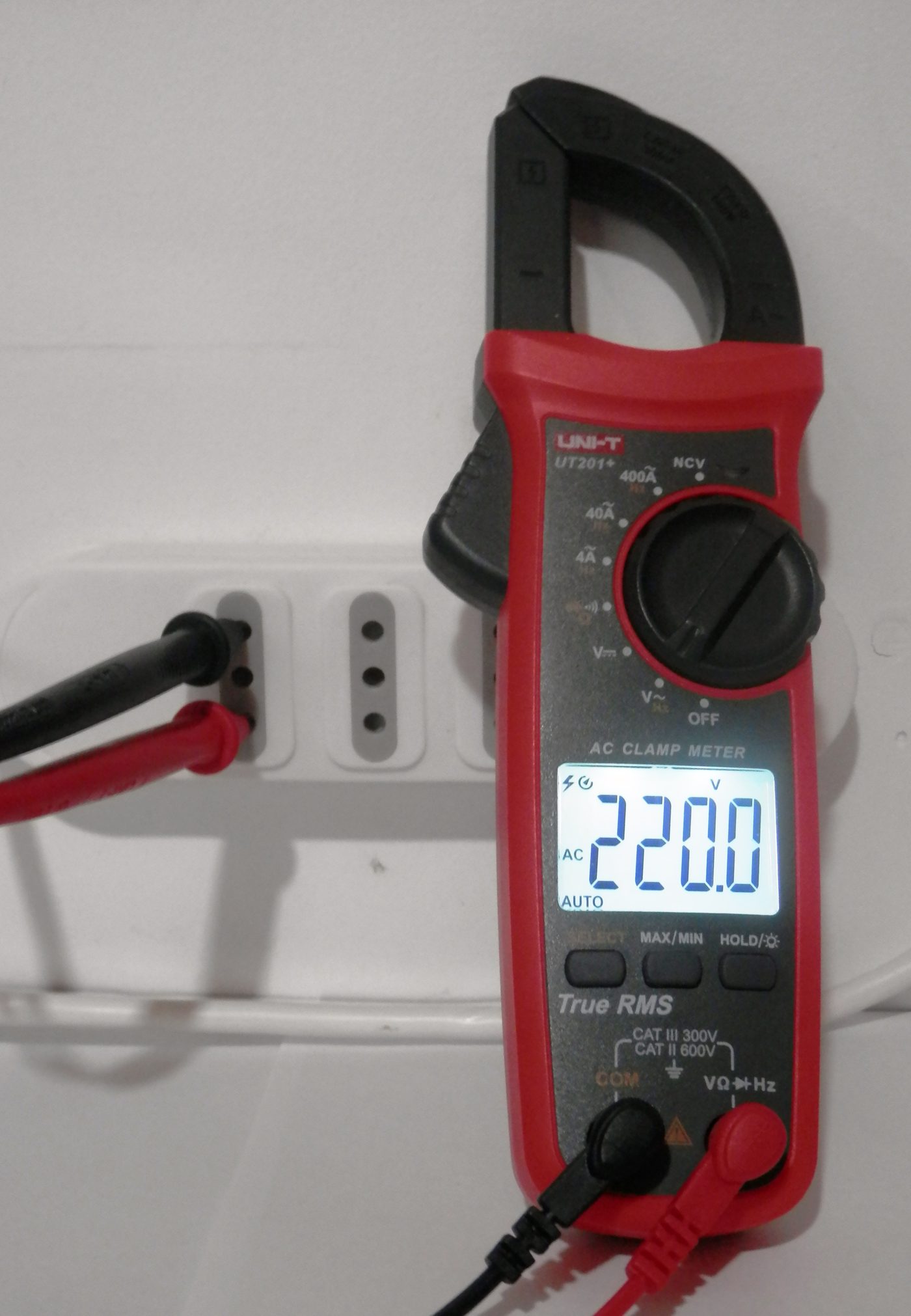 Digital clamp meter measuring voltage