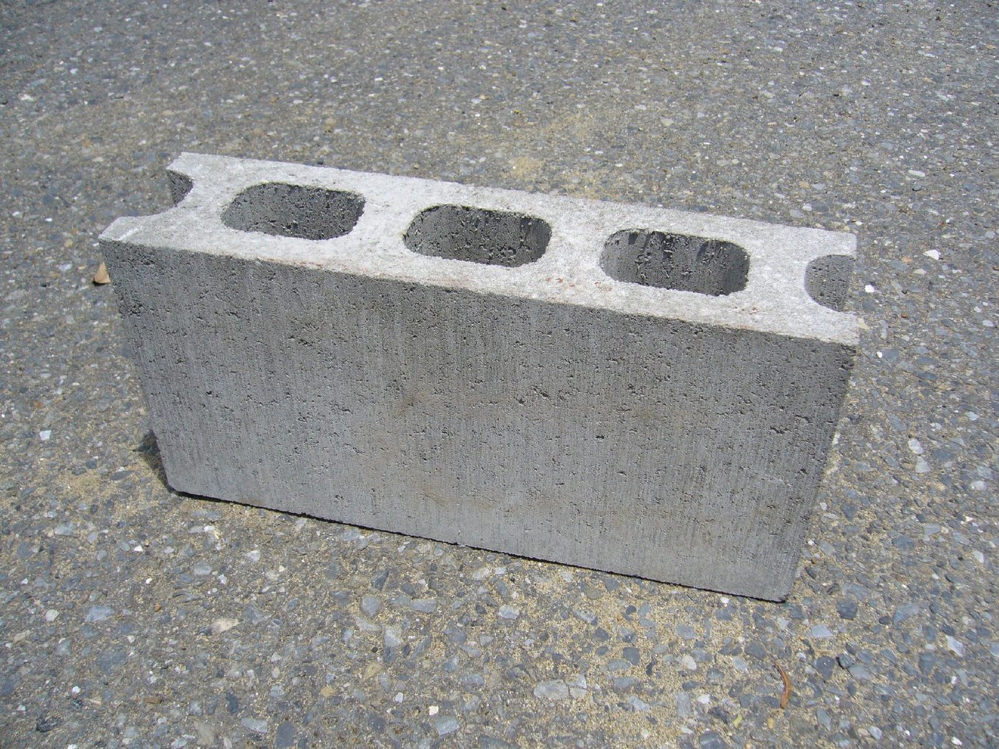 A concrete block on pavement