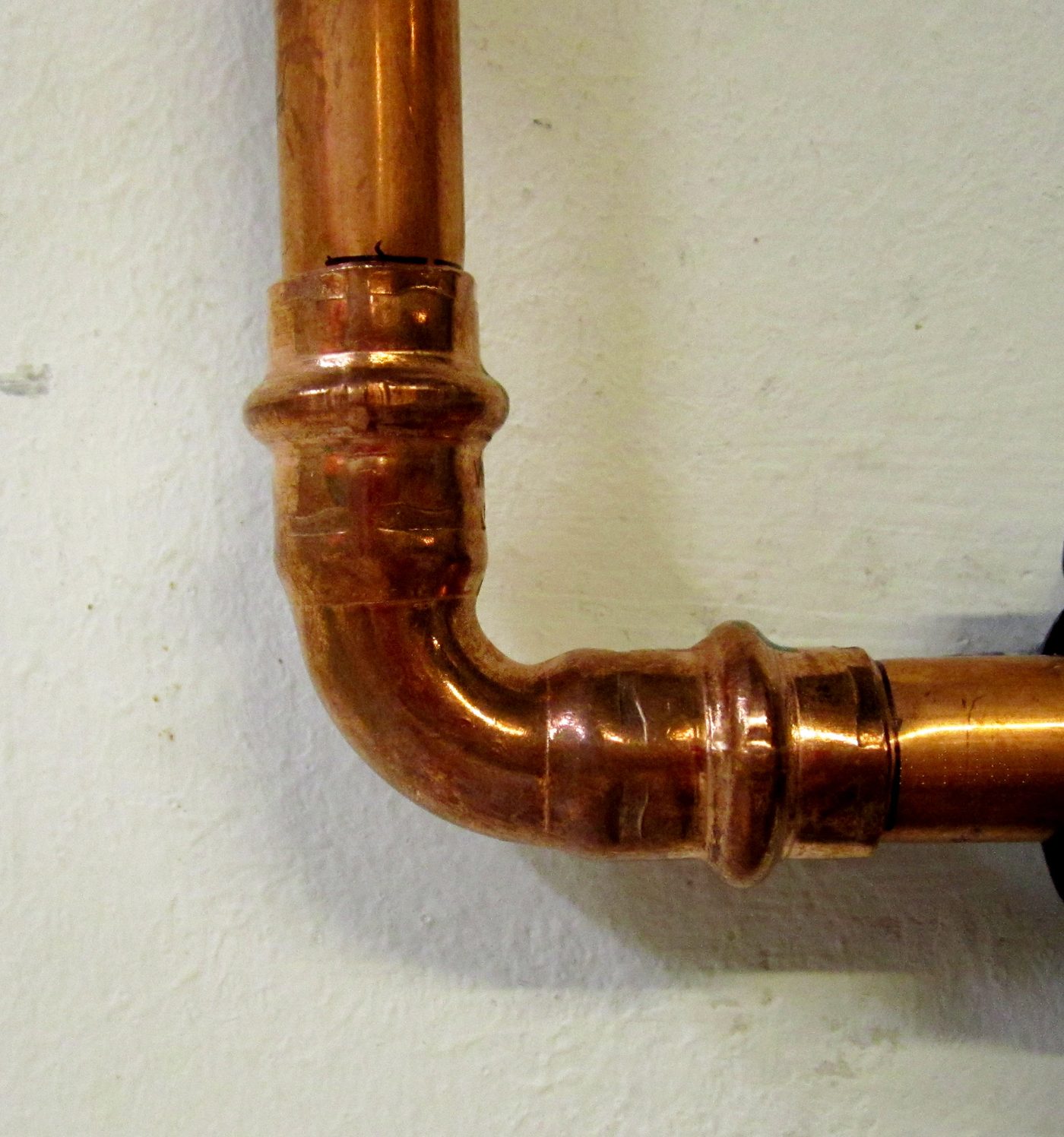 Copper pipe with elbow fitting