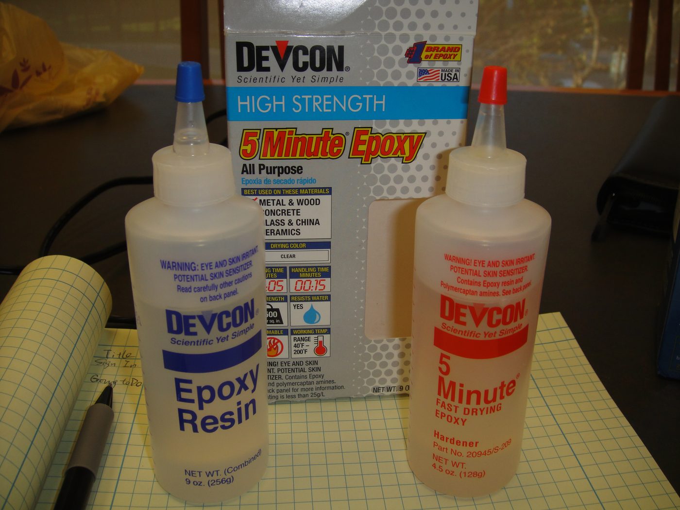 Bottles of Devcon epoxy resin and hardener