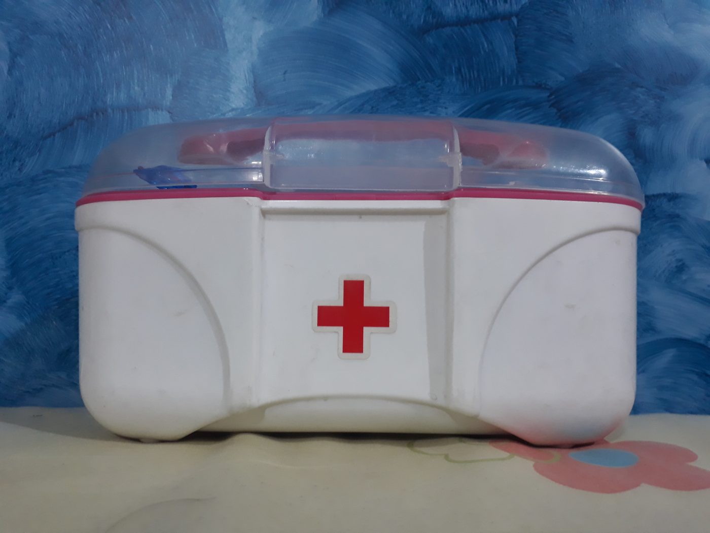 Plastic first aid kit box with red cross