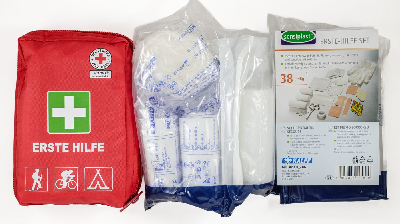 Red first aid kit with supplies