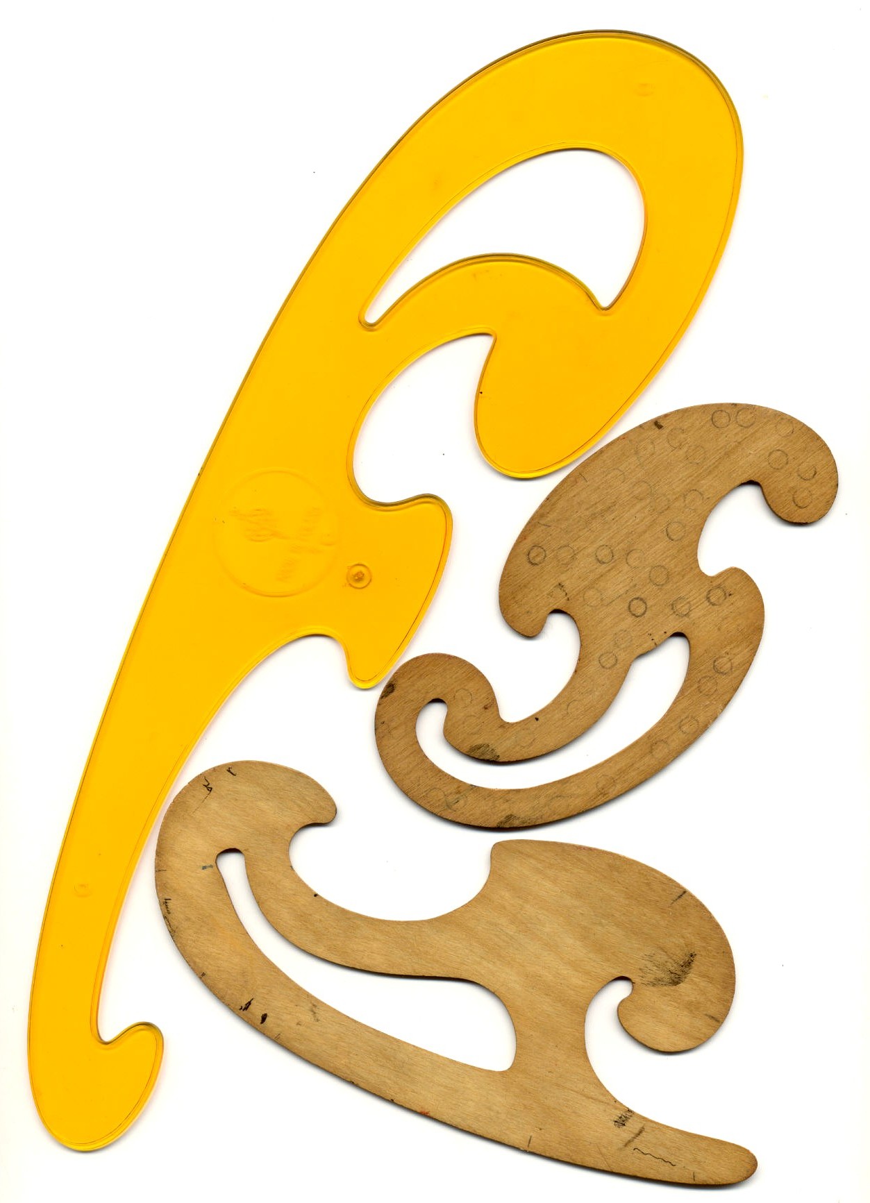 Three French curves used for drawing smooth curves