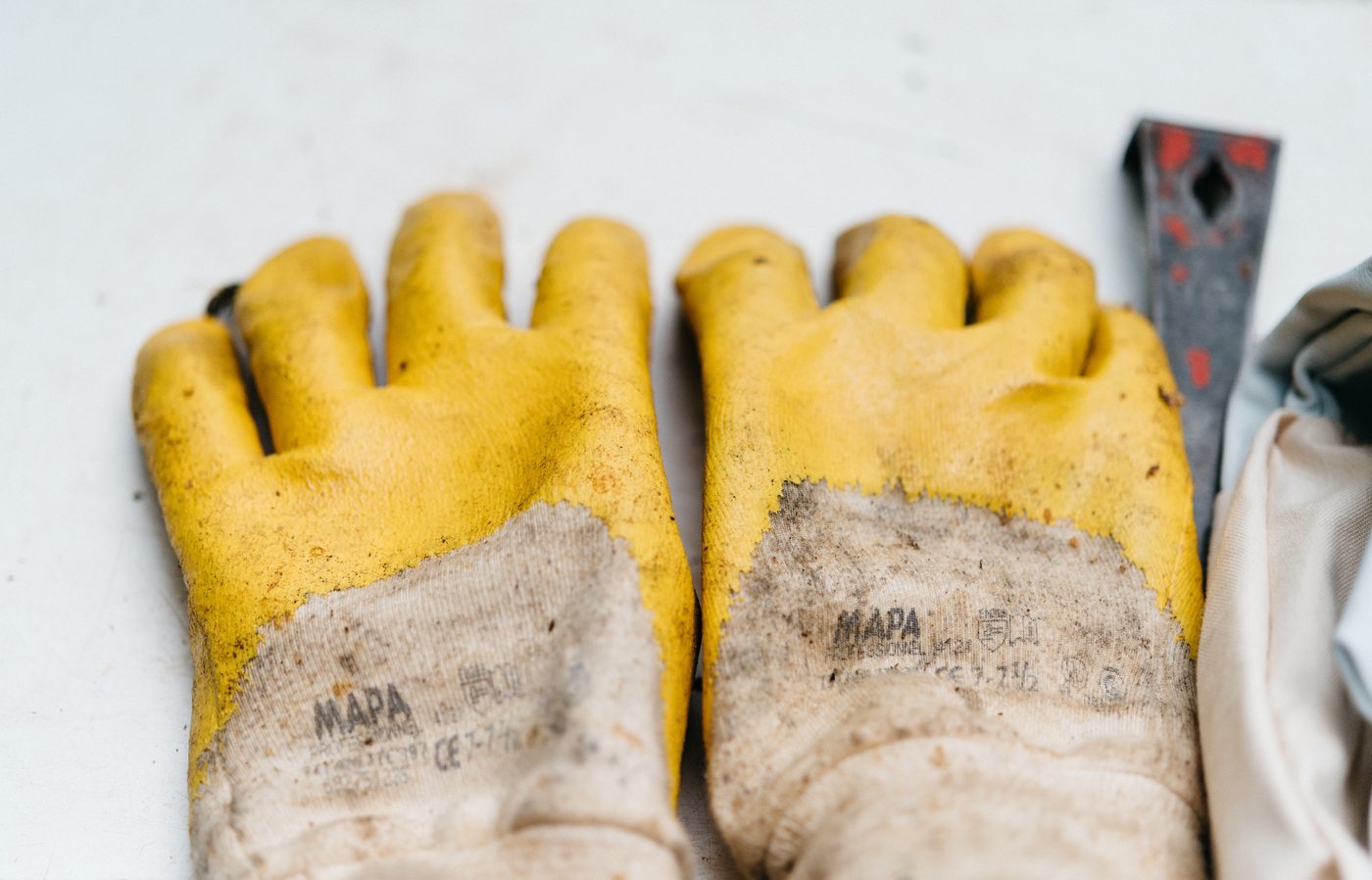 Pair of yellow work gloves used in carpentry