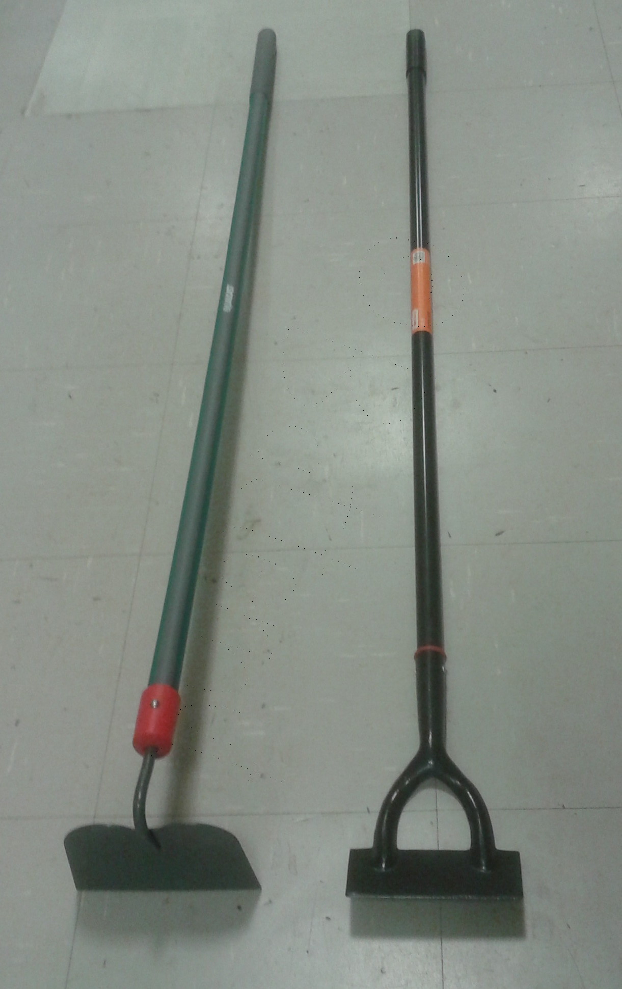 Two garden hoes with long handles