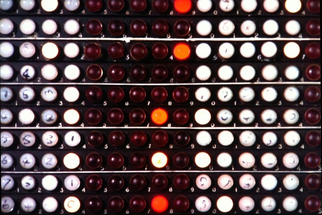 Multiple indicator lamps on a control panel