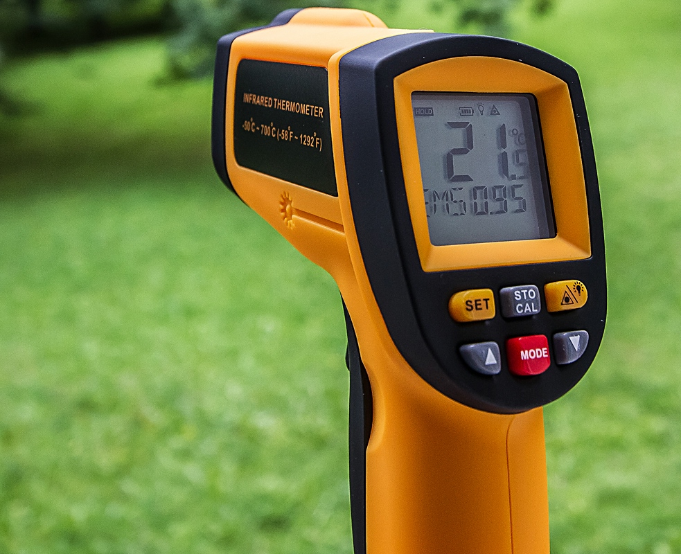 Handheld infrared thermometer measuring temperature