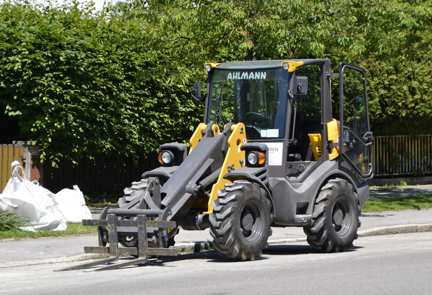 A yellow and black construction loader vehicle