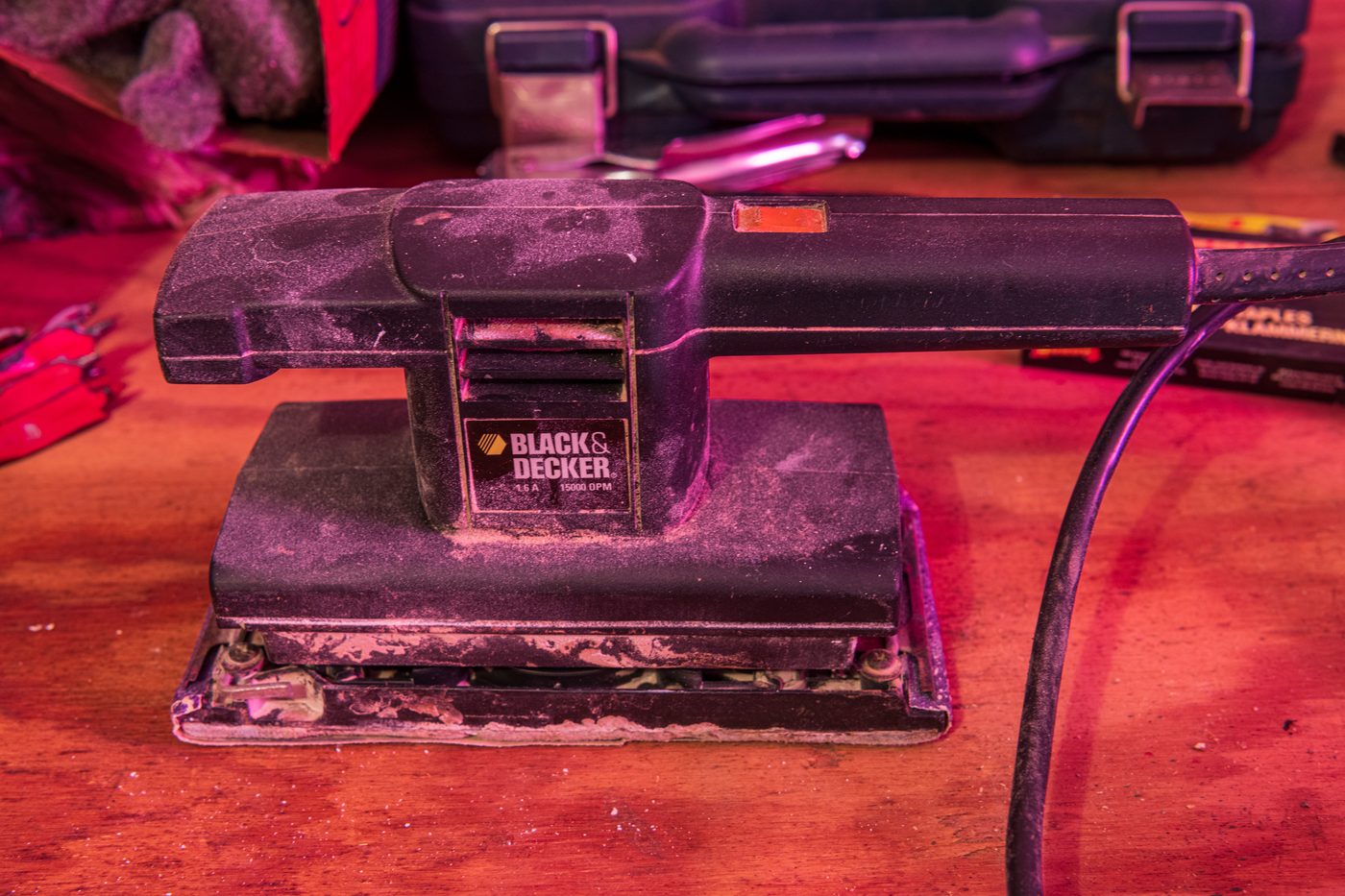 Black & Decker orbital sander on workbench