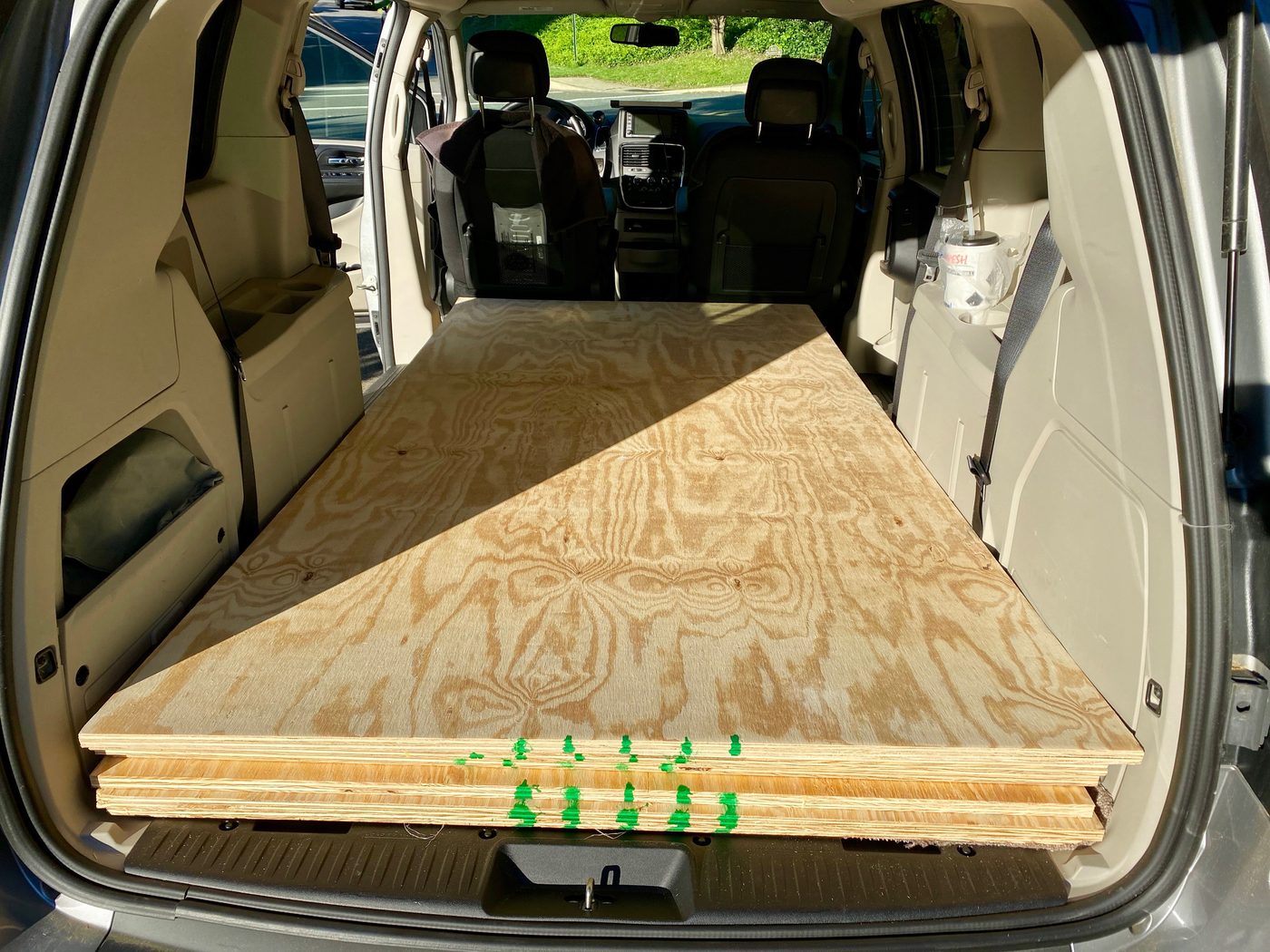 Stack of plywood sheets in vehicle