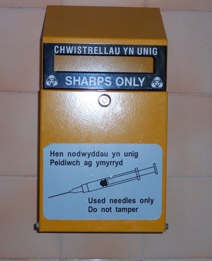 Yellow sharps disposal bin for used needles
