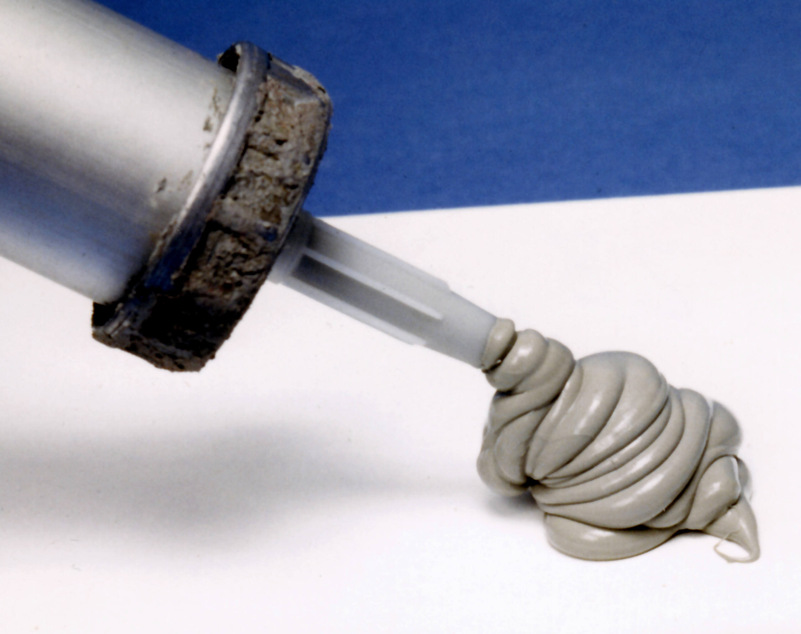 Silicone-based lubricant being dispensed from tube