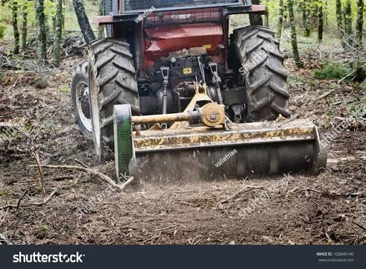 A tractor with a brush cutter