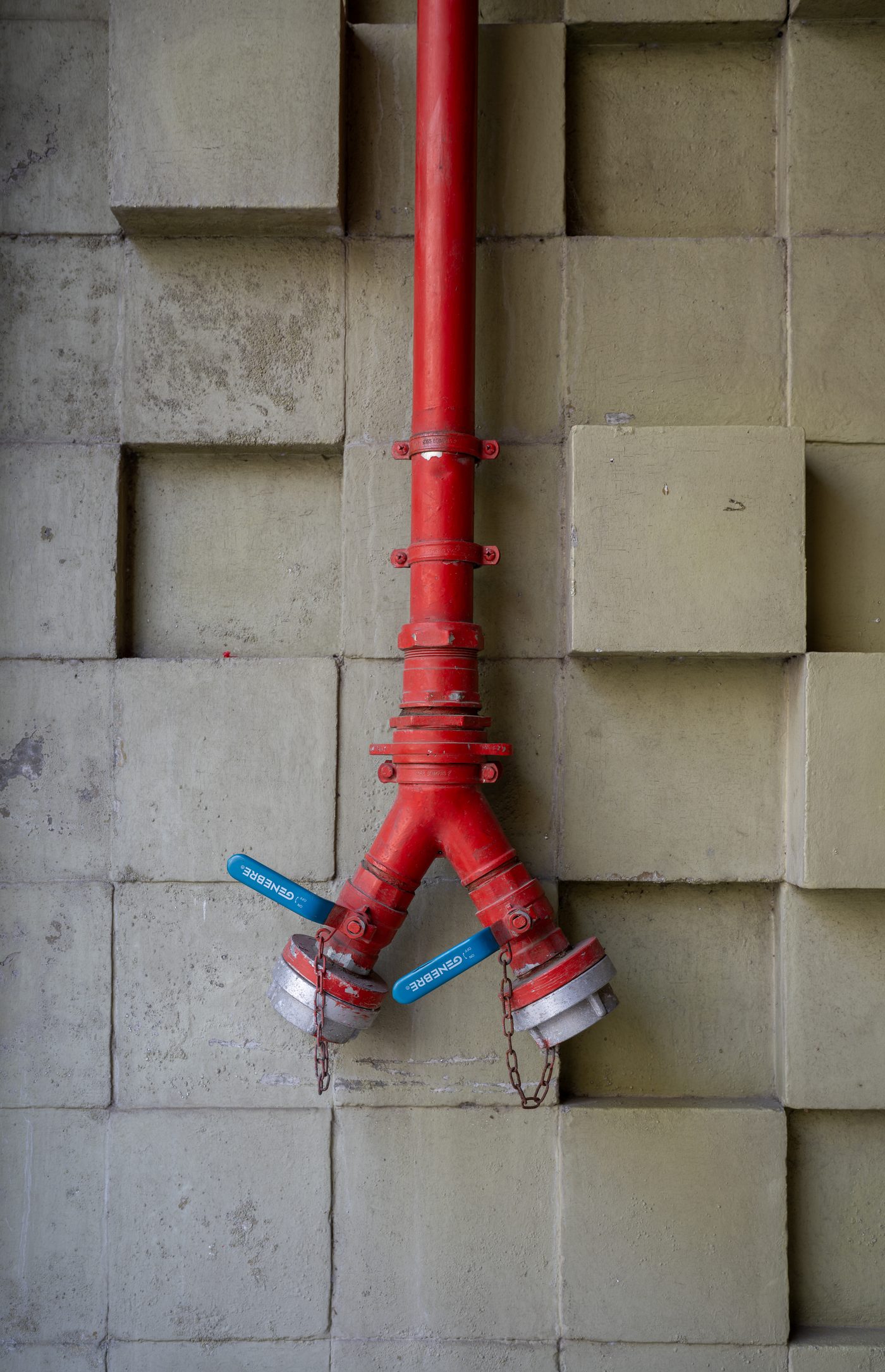 Red wall hydrant with two outlets